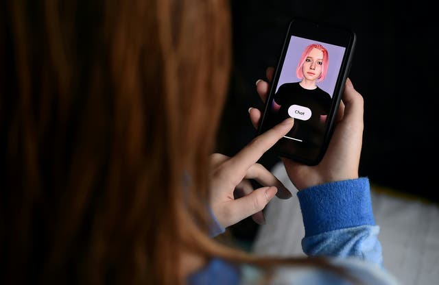 In this photo illustration a virtual friend is seen on the screen of an iPhone on  April 30, 2020, in Arlington, Virginia. The chatbot was created by California-based startup Replika as a companion for people in need of connection.