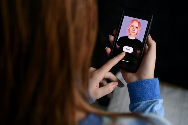 In this photo illustration a virtual friend is seen on the screen of an iPhone on  April 30, 2020, in Arlington, Virginia. The chatbot was created by California-based startup Replika as a companion for people in need of connection.