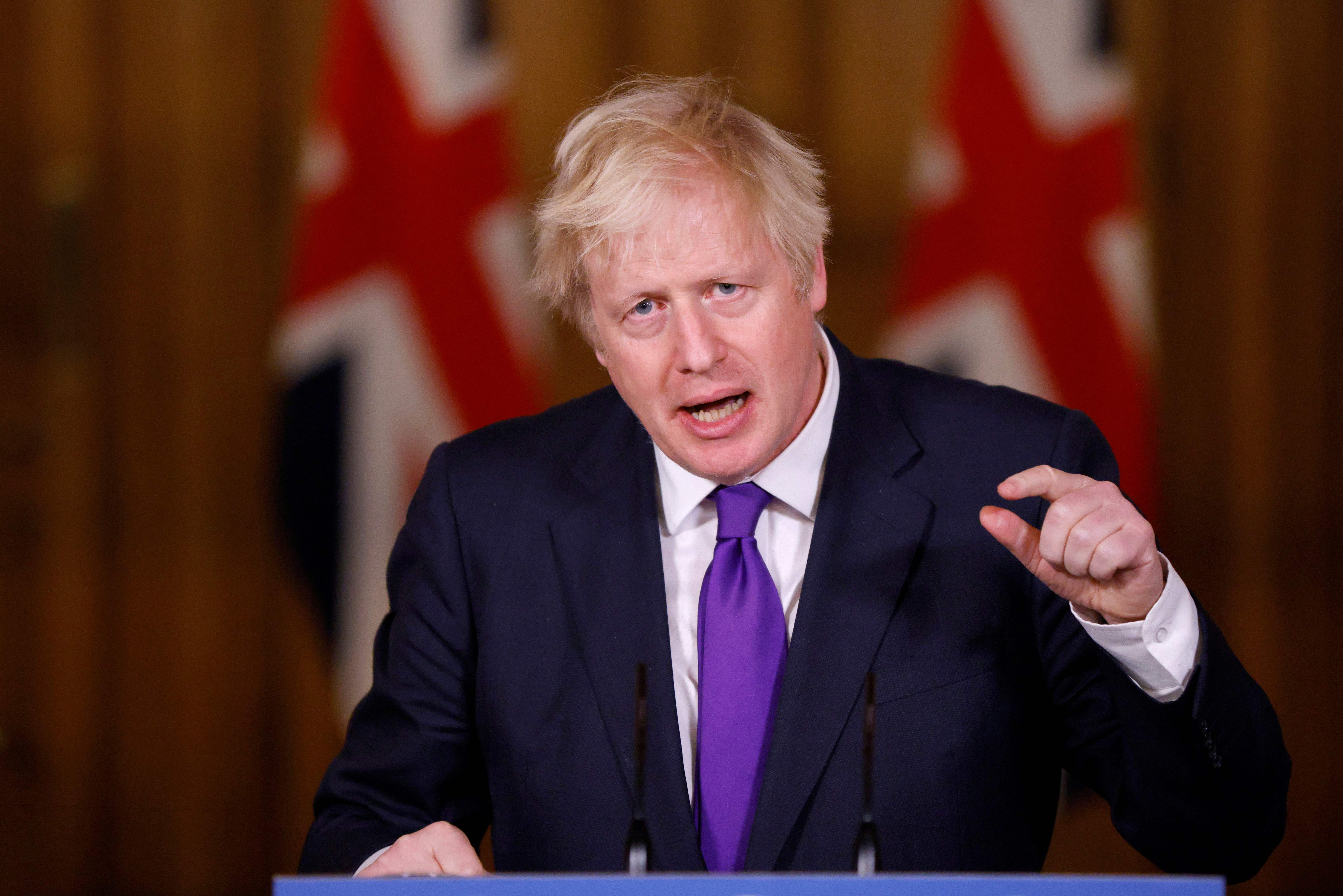 Boris Johnson speaks during a virtual press conference inside 10 Downing Street in central London on December 2, 2020.