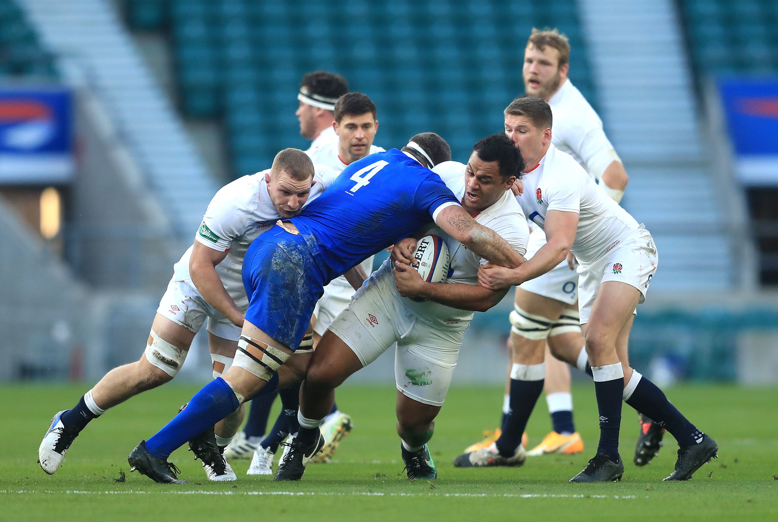 Billy Vunipola is tackled by Baptiste Pesenti during the Autumn Nations Cup final