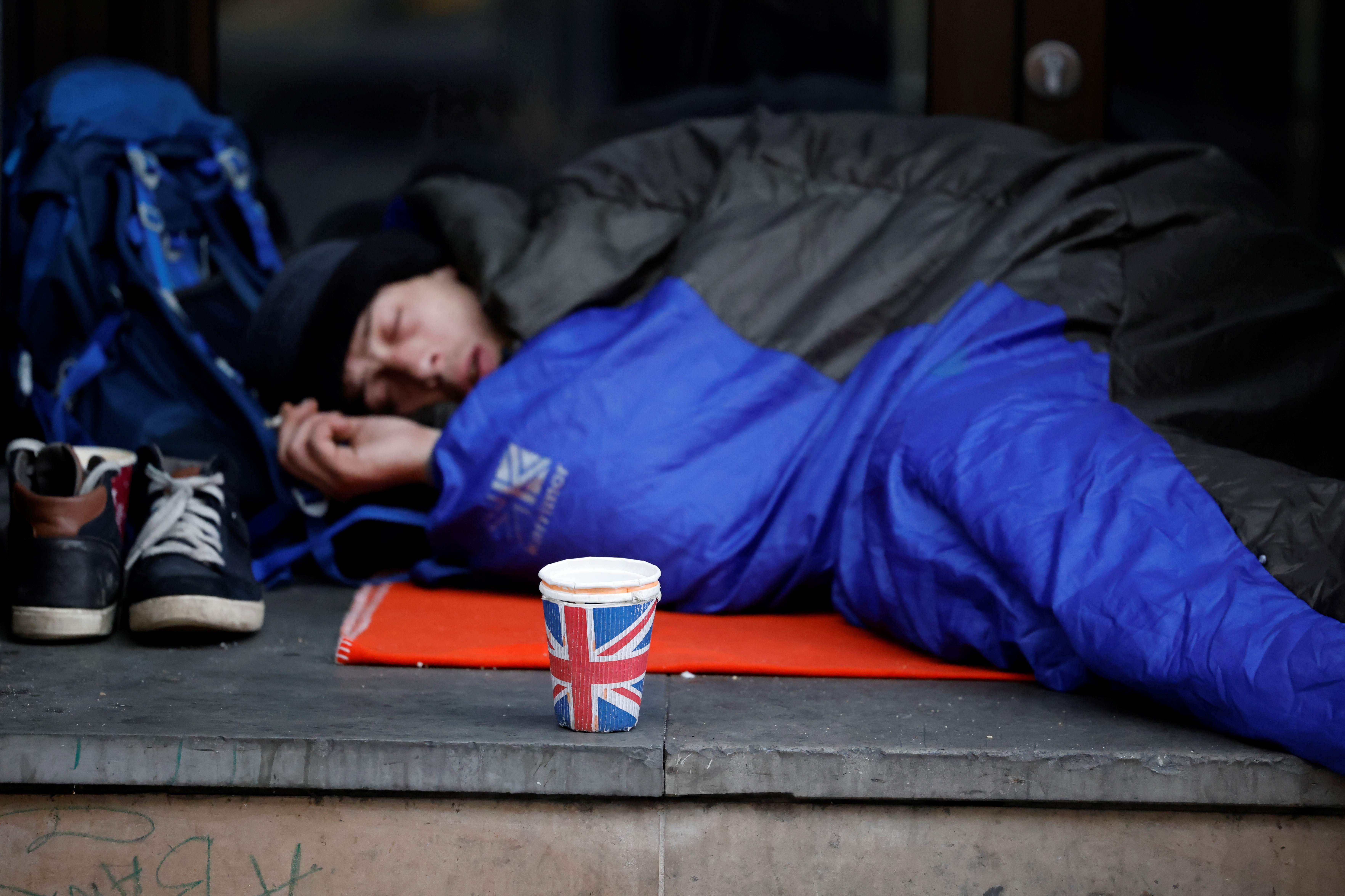 A homeless man sleeping rough in London