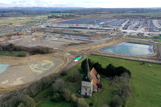<p>A view of St Mary’s Church and the construction work at the neighbouring Sevington inland border facility in Ashford, Kent on 6 November, 2020.</p>