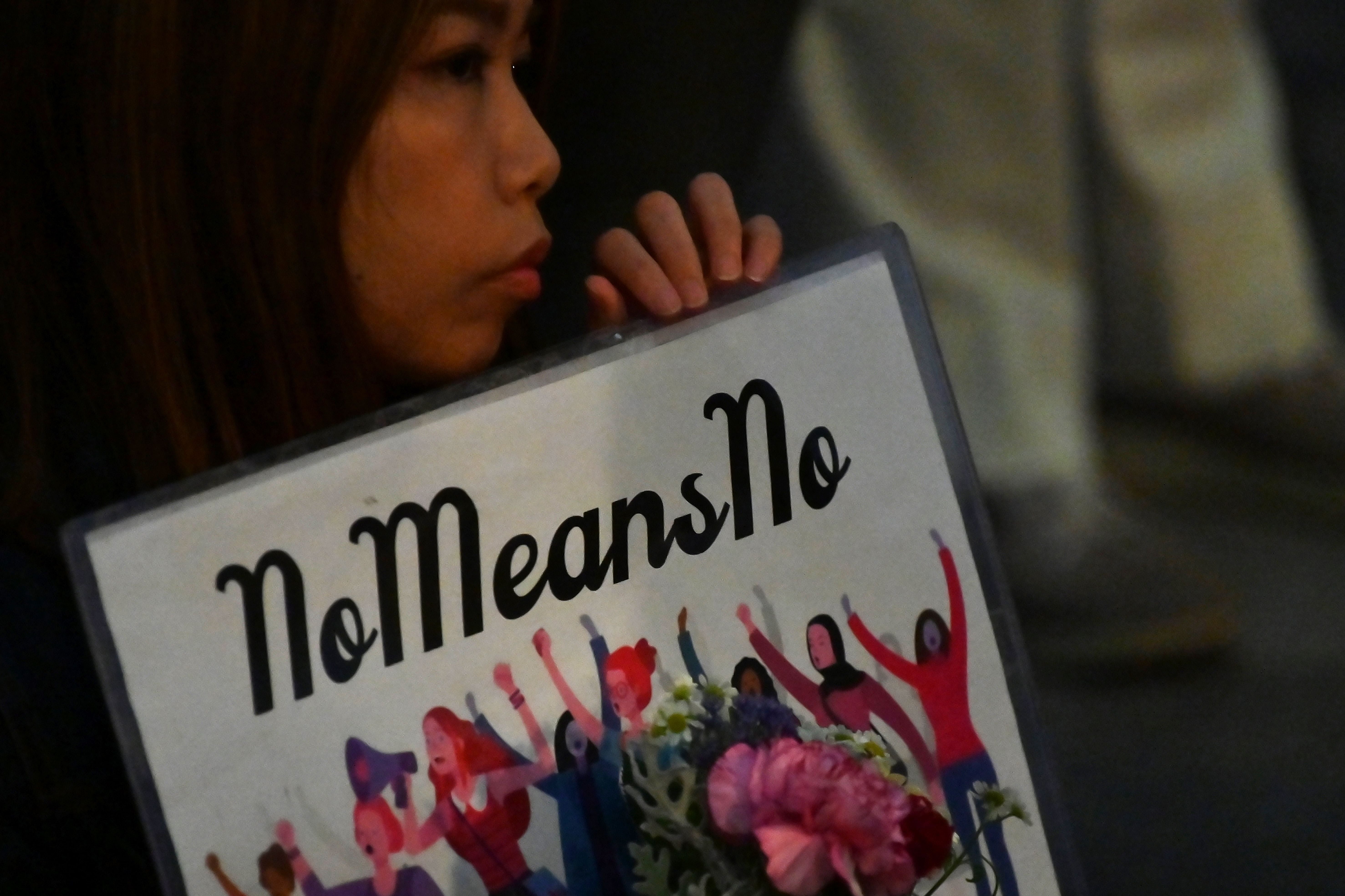 A demonstrator holds a placard during a protest against the lack of substantial legal protection for sexual assault victims in Tokyo in June 2019