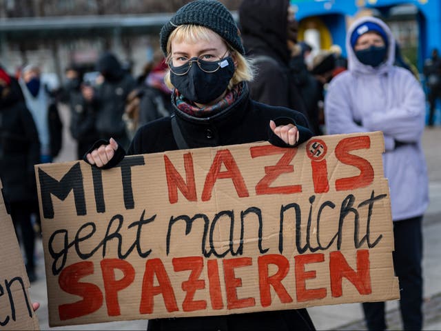 A woman counter protesting against a neo-Nazi-led anti-lockdown demonstration in Leipzig last month