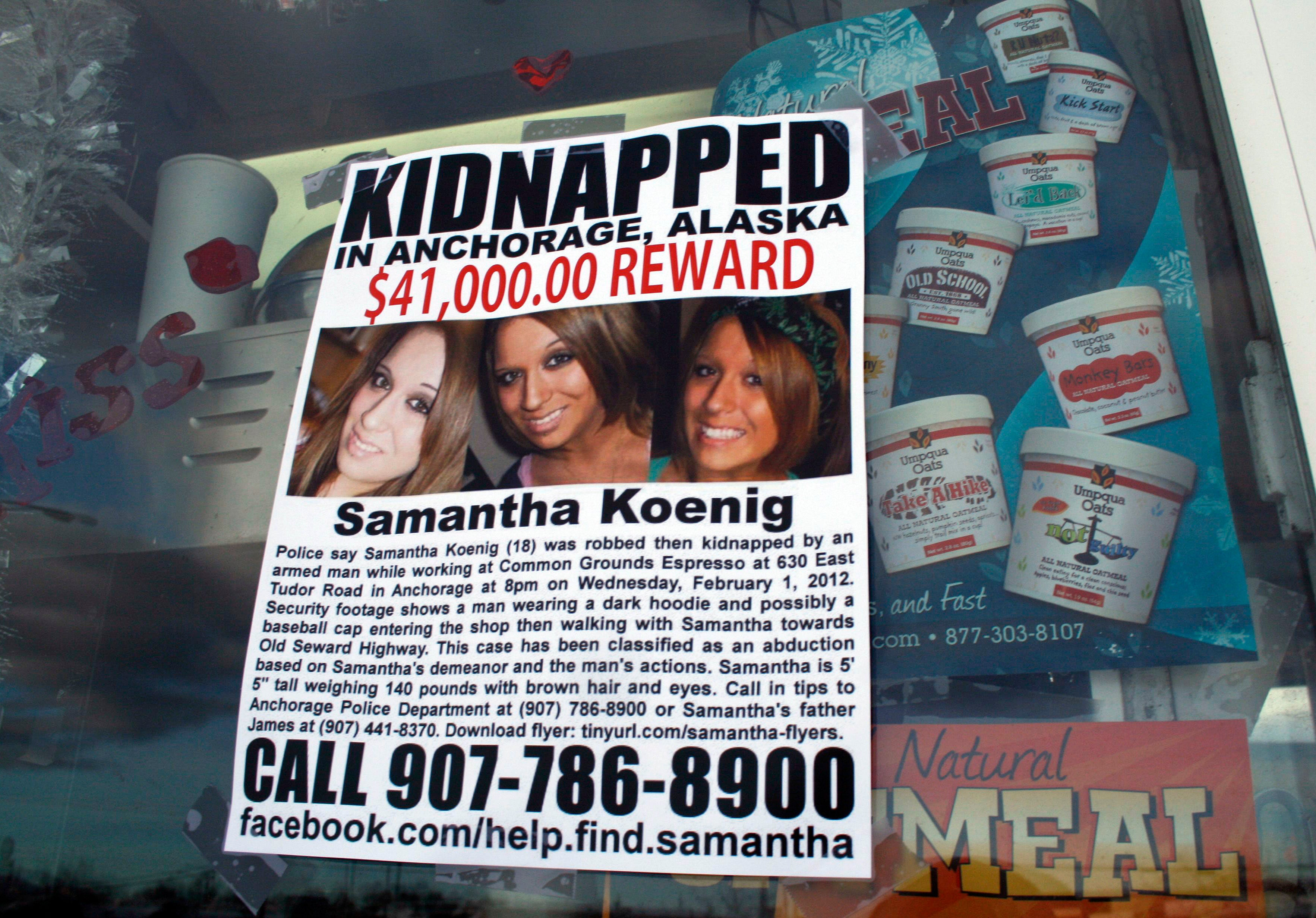 A missing person poster for Samantha Koenig is displayed on the window of the coffee shop from which Keyes abducted her in Alaska