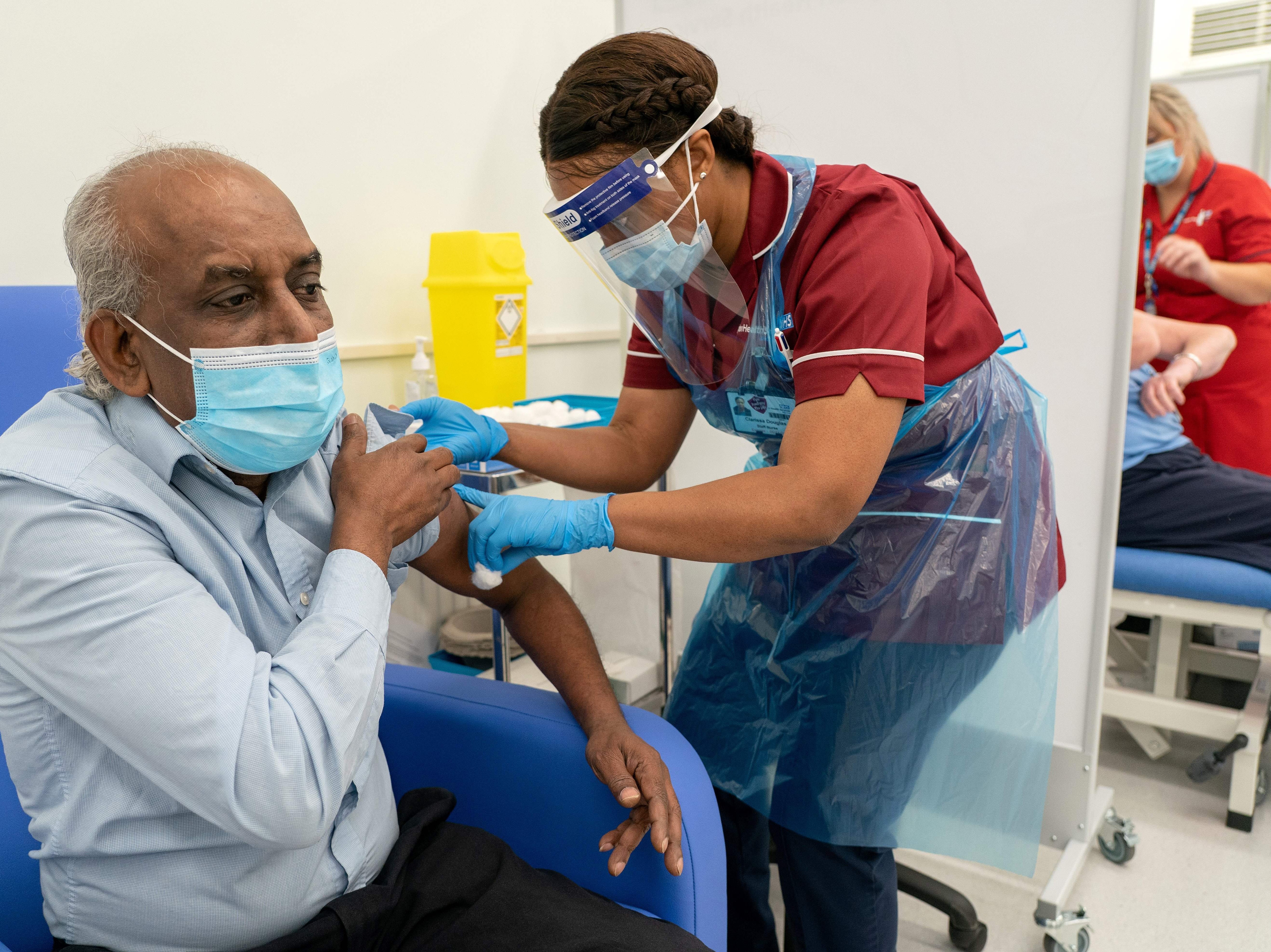 NHS staff administer the first doses of the Pfizer/BioNTech vaccine in the UK