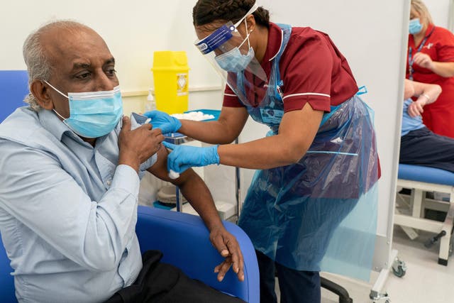 NHS staff administer the first doses of the Pfizer/BioNTech vaccine in the UK
