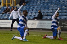 QPR players celebrate goal at Millwall by taking the knee