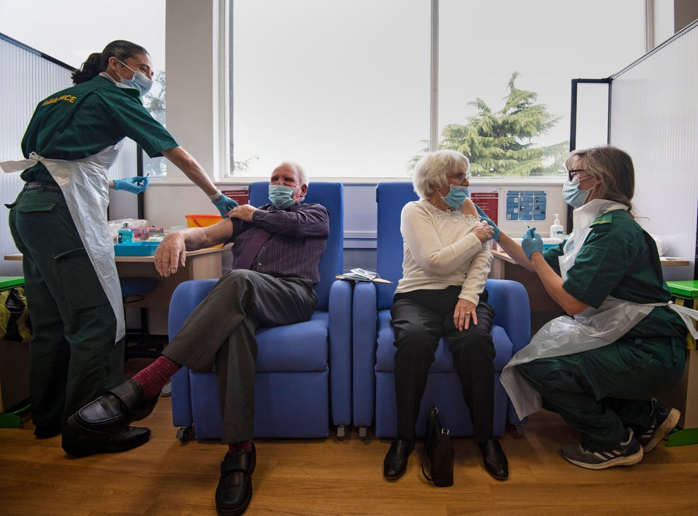 Husband and wife Vic and Penny Griffiths receive the Pfizer/BioNTech covid-19 vaccine at Basildon University Hospital