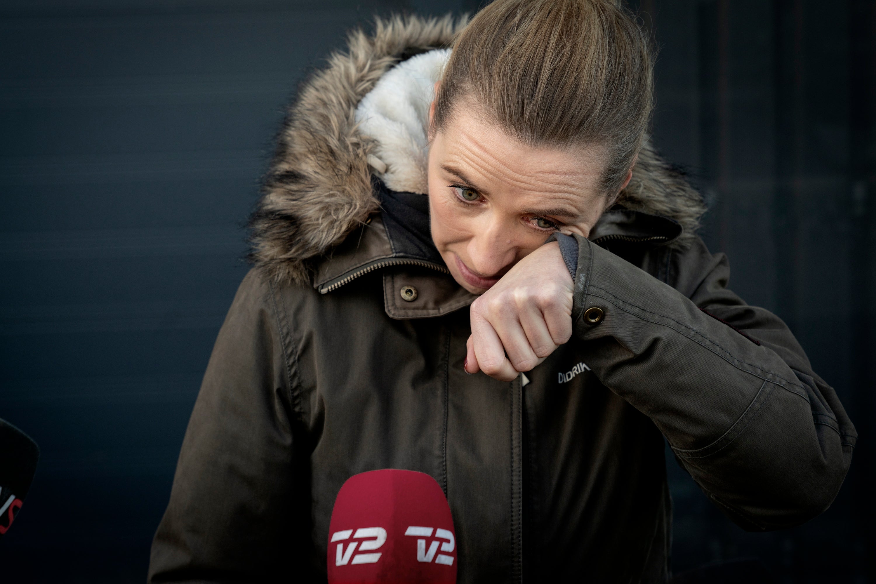 Denmark's Prime Minister Mette Frederiksen reacts after a visit to an empty mink farm