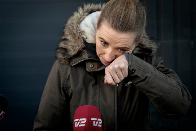 <p>Denmark's Prime Minister Mette Frederiksen reacts after a visit to an empty mink farm</p>