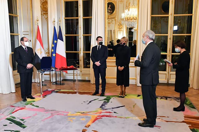 <p>President Abdel Fattah al-Sisi (left) at the Elysee Palace on 7 December, with his French counterpart Emmanuel Macron (second left)</p>