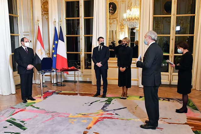 <p>President Abdel Fattah al-Sisi (left) at the Elysee Palace on 7 December, with his French counterpart Emmanuel Macron (second left)</p>