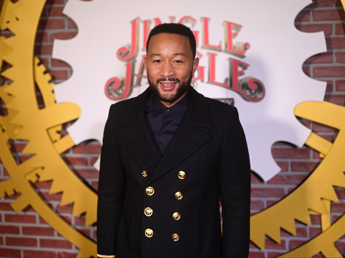 John Legend hugs and tips busker who performs his song