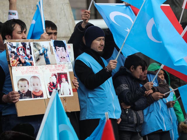 <p>Uighurs in Turkey stage a rally earlier this year to remember a massacre in Xinjiang</p>