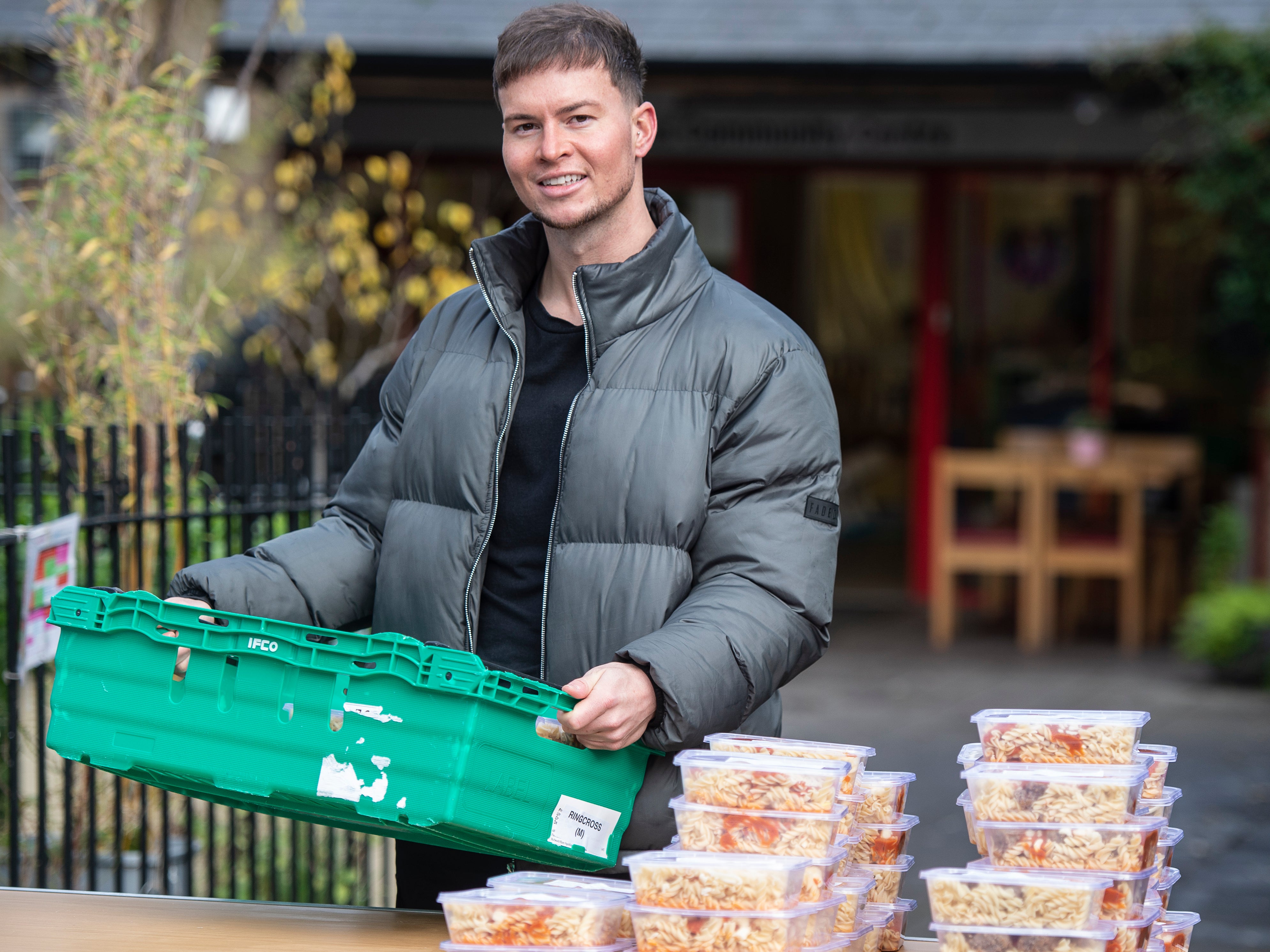 British DJ, producer and television personality, Joel Corry pictured helping distribute cooked meals at Ringcross Community Centre Foodbank