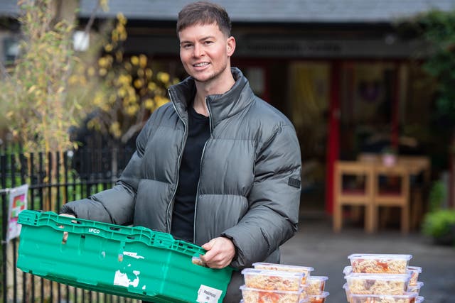British DJ, producer and television personality, Joel Corry pictured helping distribute cooked meals at Ringcross Community  Centre Foodbank