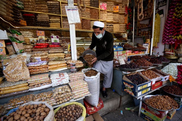 A man sells dry fruits at his shop in Peshawar, Pakistan, 27 November 2020. After a good raining season, the sales of dry fruits flourish in the country. Tourists from all over Pakistan come to Peshawar to purchase dry fruits along with other items because of price differences between different parts of the country.  EPA/BILAWAL ARBAB