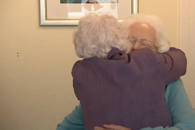 <p>June Crawford and Ella Boyle hug each other for the first time since being separated by the pandemic</p>