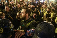 Proud Boys burn BLM banner while making white supremacy signs