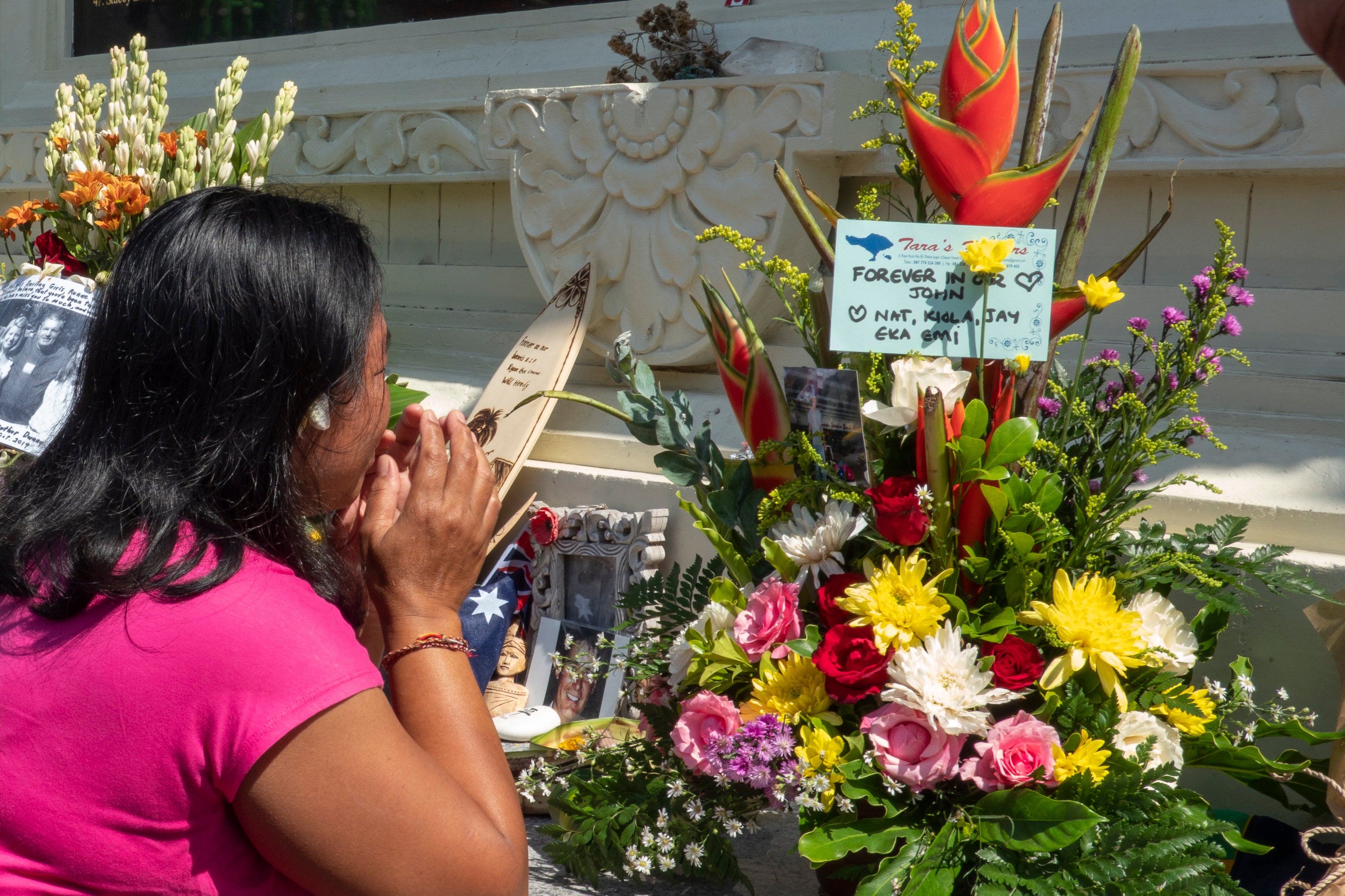 Relatives mourn in front of the Bali bombings memorial on last year’s 17th anniversary of the attack, in Kuta, Bali