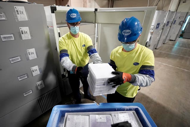 <p>Boxes containing the Pfizer-BioNTech Covid-19 vaccine are prepared to be shipped</p>
