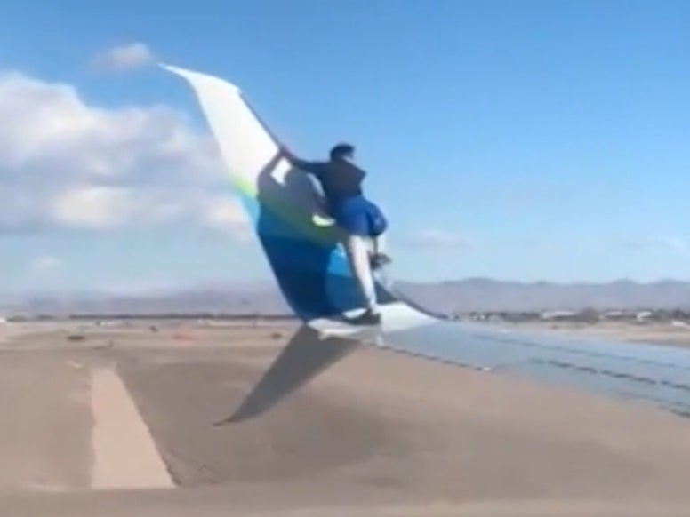 The man tried to climb up the winglet