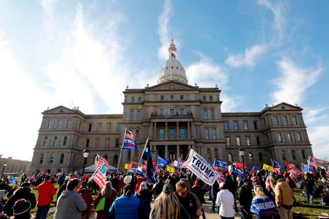 People gather at the Michigan State Capitol for a “Stop the Steal” rally in support of US President Donald Trump on 14 November, 2020