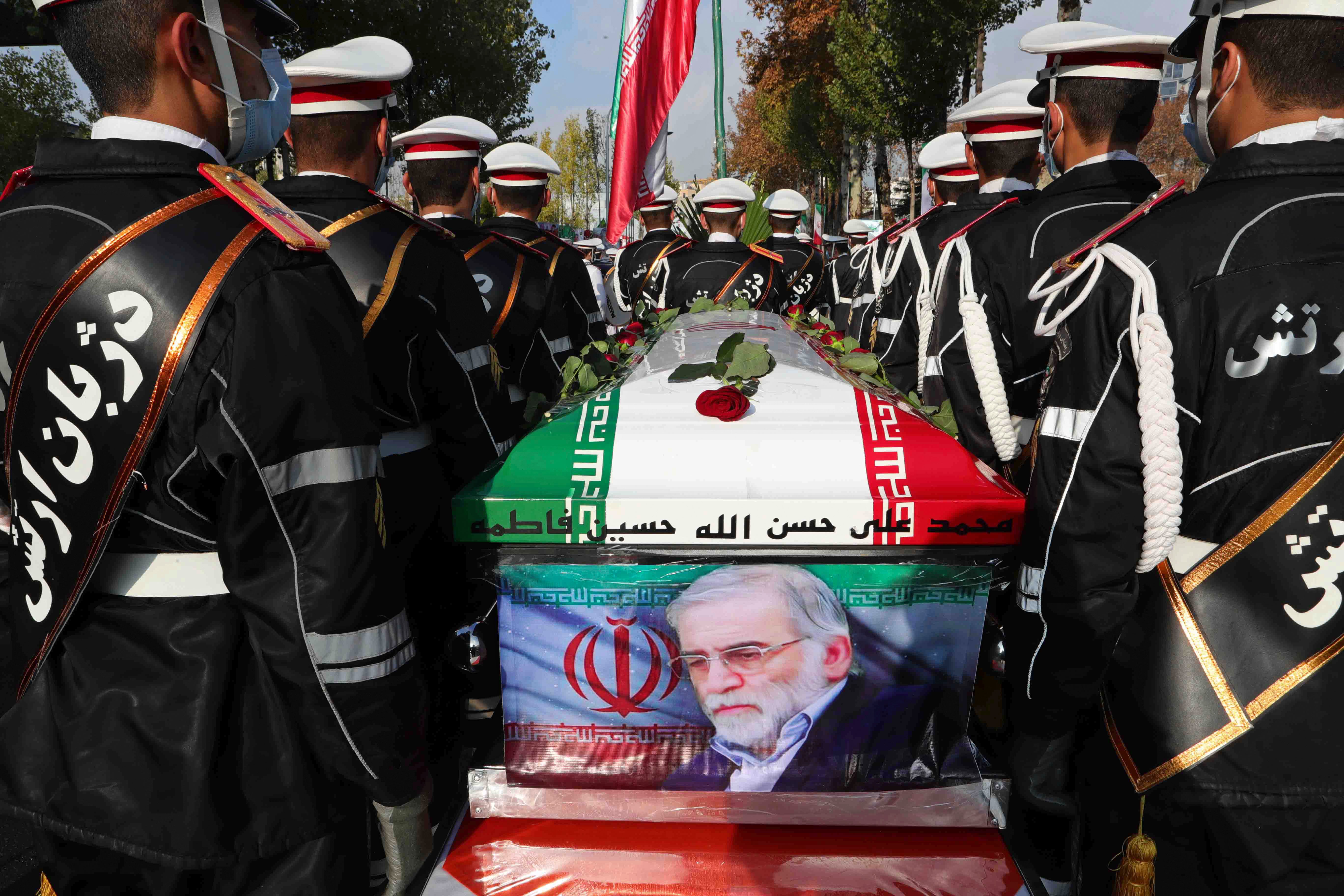 The flag-draped coffin of Mohsen Fakhrizadeh, the nuclear scientist killed last month (Iranian Defence Ministry via AP)