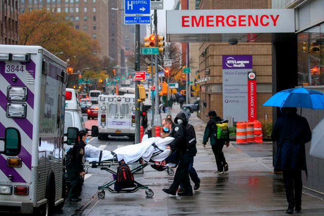 A patient is transported outside of Tisch Hospital in New York on 13 November, 2020