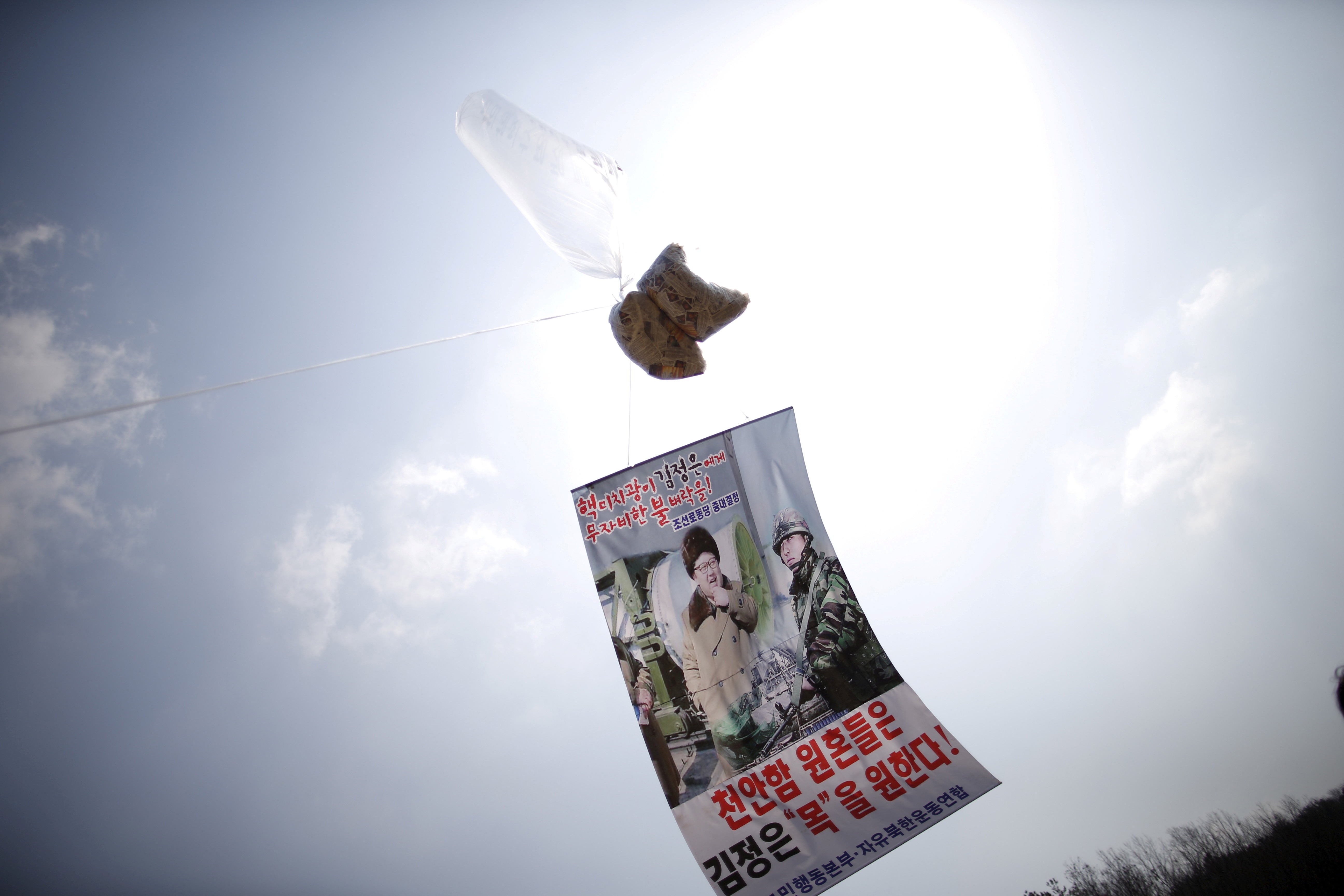 FILE PHOTO: A balloon containing leaflets denouncing North Korean leader Kim Jong Un is seen near the demilitarised zone separating the two Koreas in Paju, South Korea