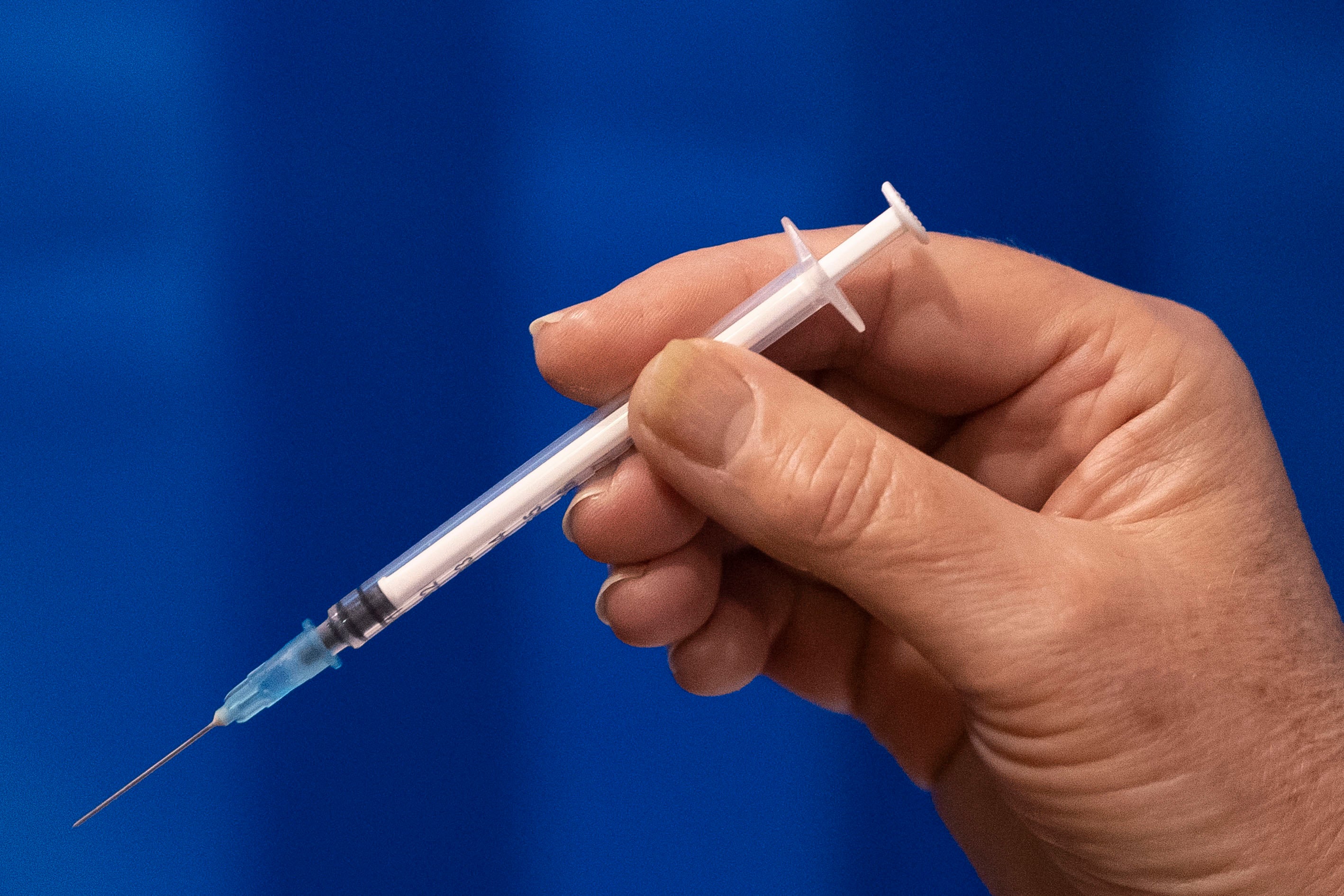 File image: A close-up of a Pfizer-BioNTech Covid-19 vaccine before it is given to a patient in Cardiff, Wales