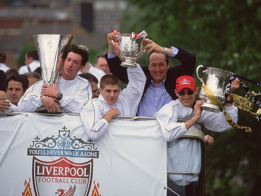 Robbie Fowler, Steven Gerrard, Gerard Houllier and Sami Hyypia parade Liverpool’s trophies in 2001