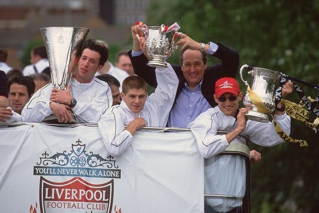 <p>Robbie Fowler, Steven Gerrard, Gerard Houllier and Sami Hyypia parade Liverpool’s trophies in 2001</p>