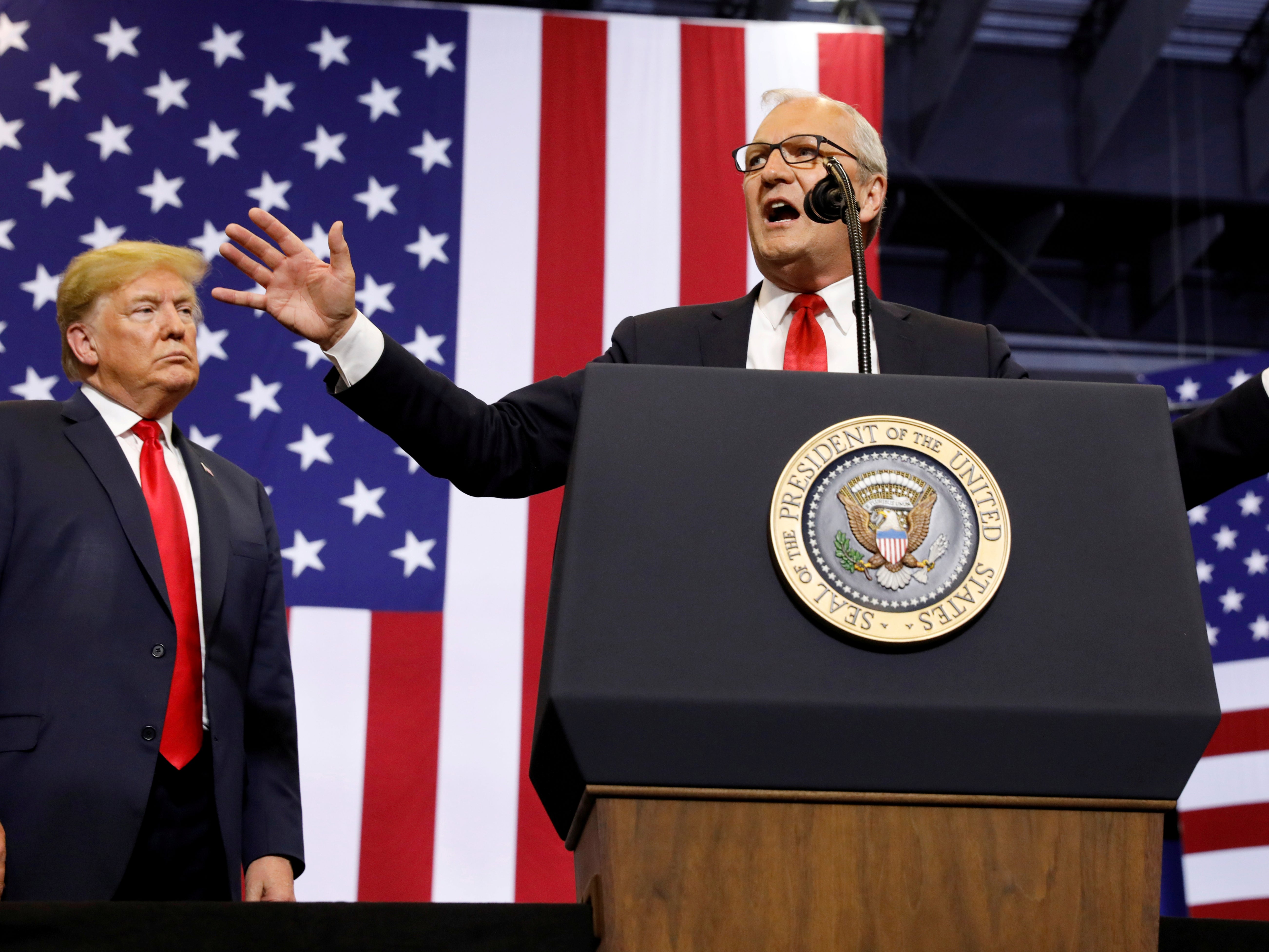 President Donald Trump listens at a rally in support of representative Kevin Cramer in his run for Senate in Fargo, North Dakota on 27 June 2018