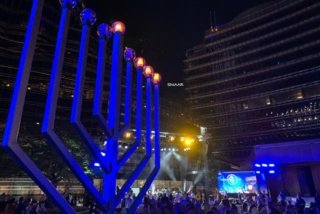 <p>Israeli tourists in Dubai gather for the third night of Hanukkah at the base of Burj Khalifa</p>