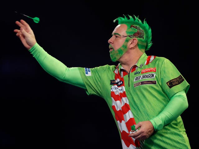 Peter Wright of Scotland in action during his round two match against Steve West