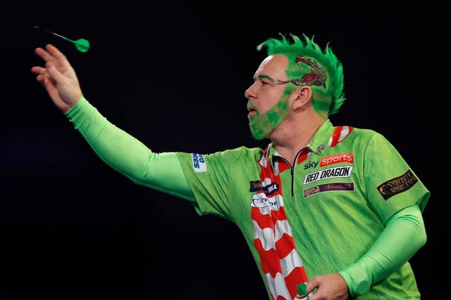 Peter Wright of Scotland in action during his round two match against Steve West