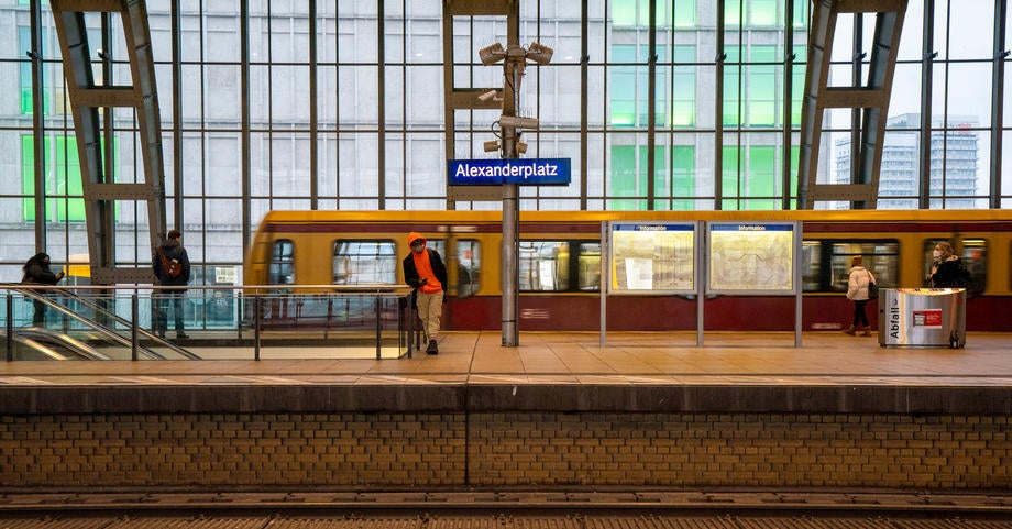 Only a few commuters travel during the morning rush hour at the Alexanderplatz station in Berlin today