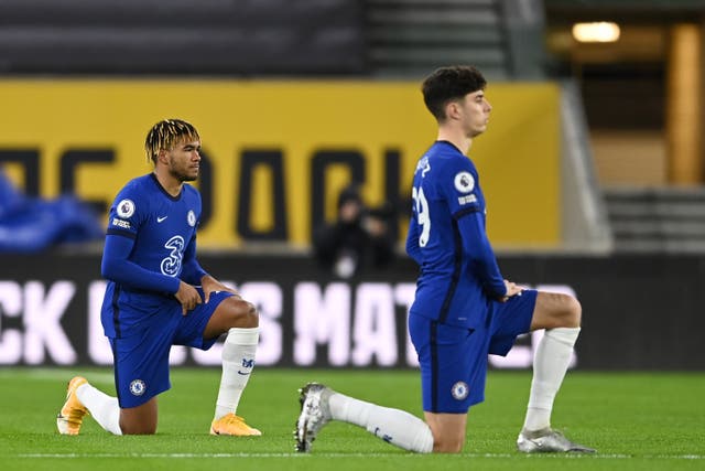 Reece James and Kai Havertz of Chelsea take a knee before Chelsea’s game with Wolves