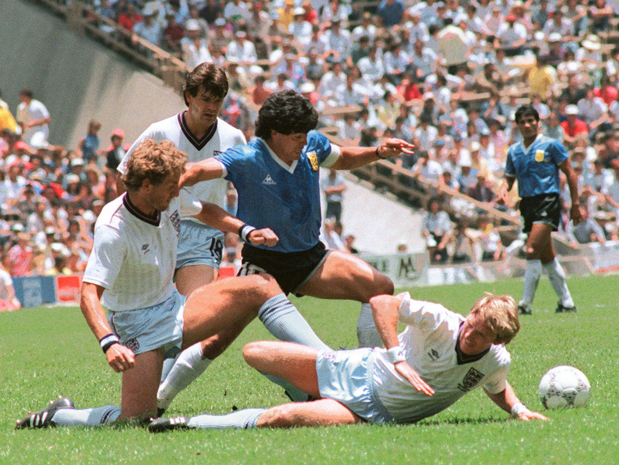 Maradona dribbles past three English players at the 1986 World Cup