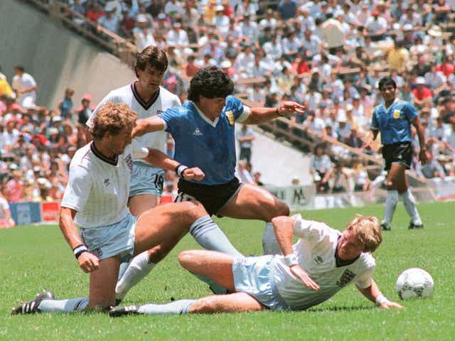 <p>Maradona dribbles past three English players at the 1986 World Cup</p>