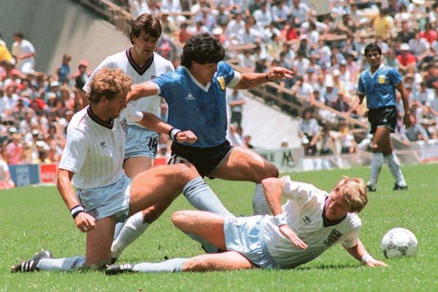 <p>Maradona dribbles past three English players at the 1986 World Cup</p>