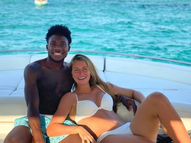 <p>Alphonso Davies was on holiday in Ibiza with his girlfriend Jordyn Huitema</p>