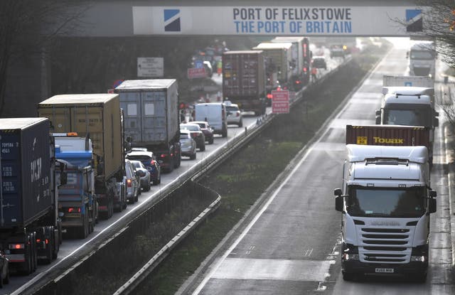 <p>Lorries drive in and out of Port of Felixstowe</p>