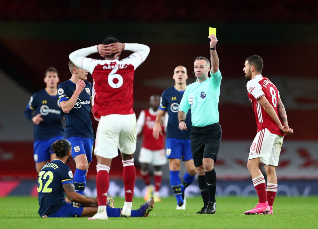 Gabriel of Arsenal is shown a second yellow card