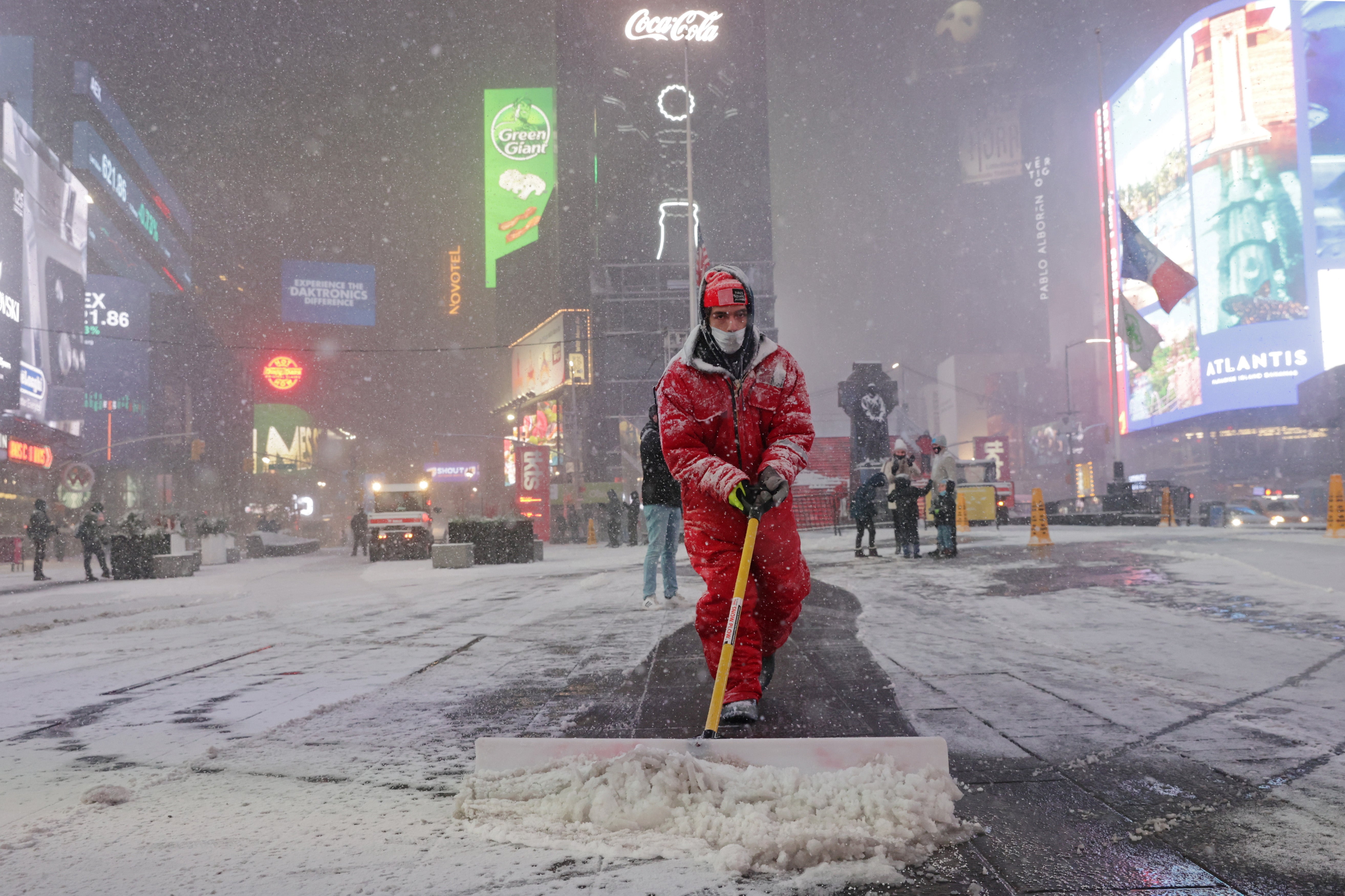 Snow begins to fall in Times Square during a Nor'easter, in New York City on 16 December.