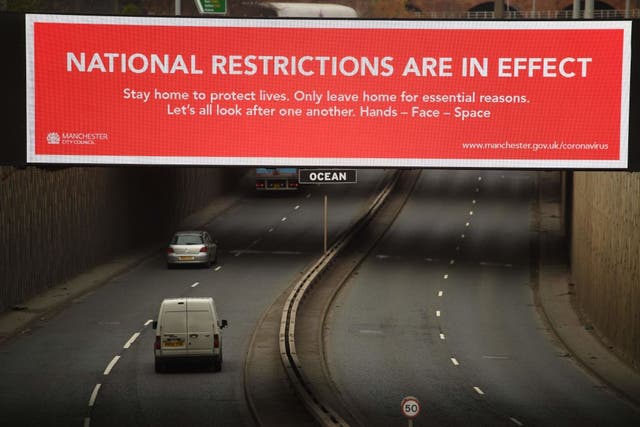 A billboard displays a Manchester City Council message about the about the national lockdown restrictions to combat coronavirus. 
