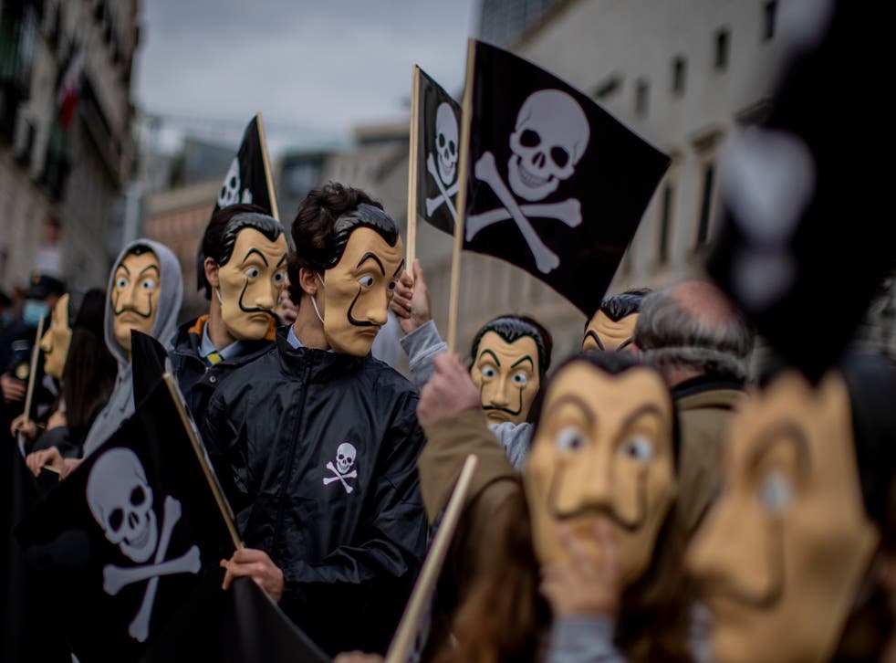 Anti-euthanasia protestors in masks outside the Spanish Parliament (AP Photo/Manu Fernandez)