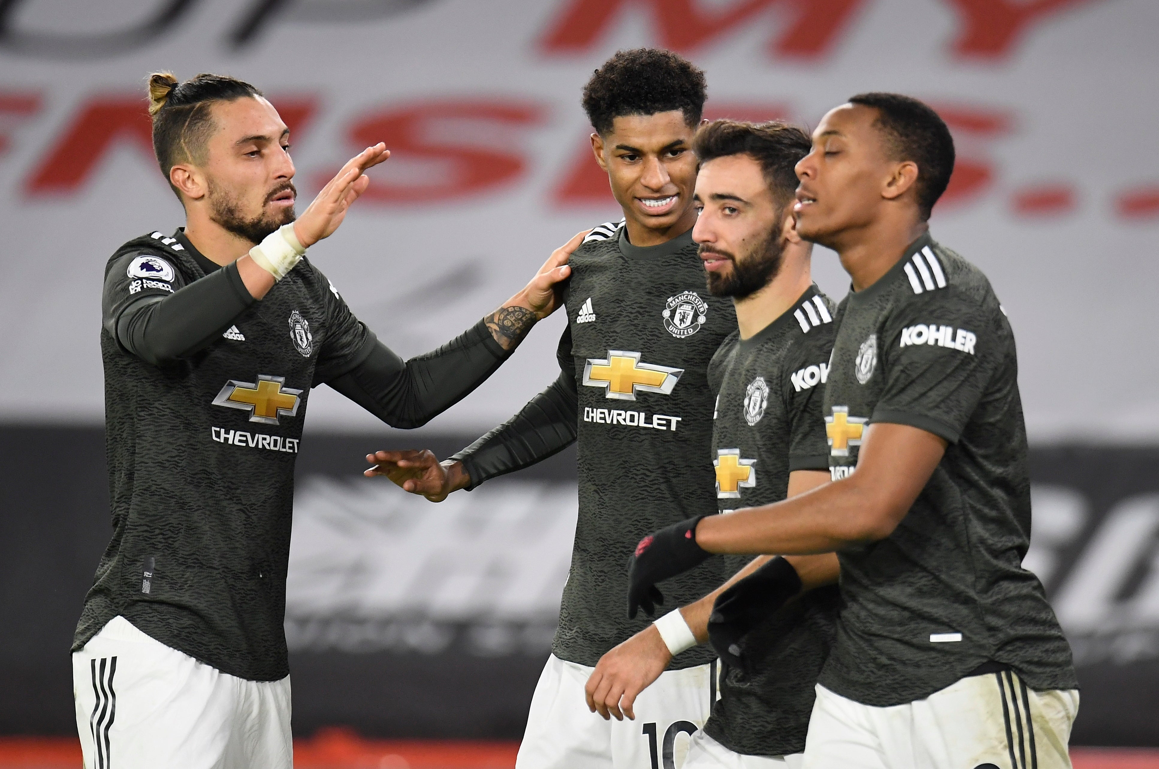 Manchester United celebrate after Marcus Rashford’s goal